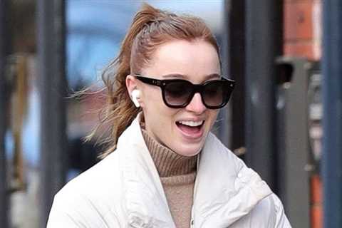 Phoebe Dynevor smiles at everything while walking her dog